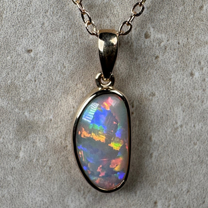 14k Gold Rolling Flash Crystal Opal Pendant
